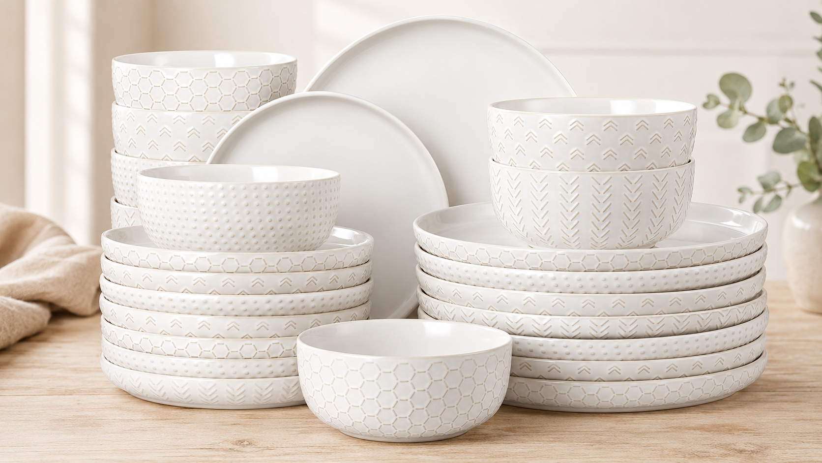 Lareina 24-piece farmhouse stoneware dinnerware set in vintage white with embossed plates and bowls.