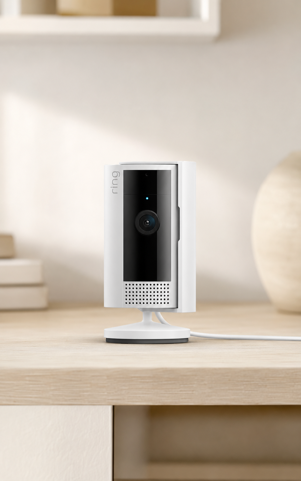 White Ring Indoor Security Camera placed on a shelf for indoor home monitoring.